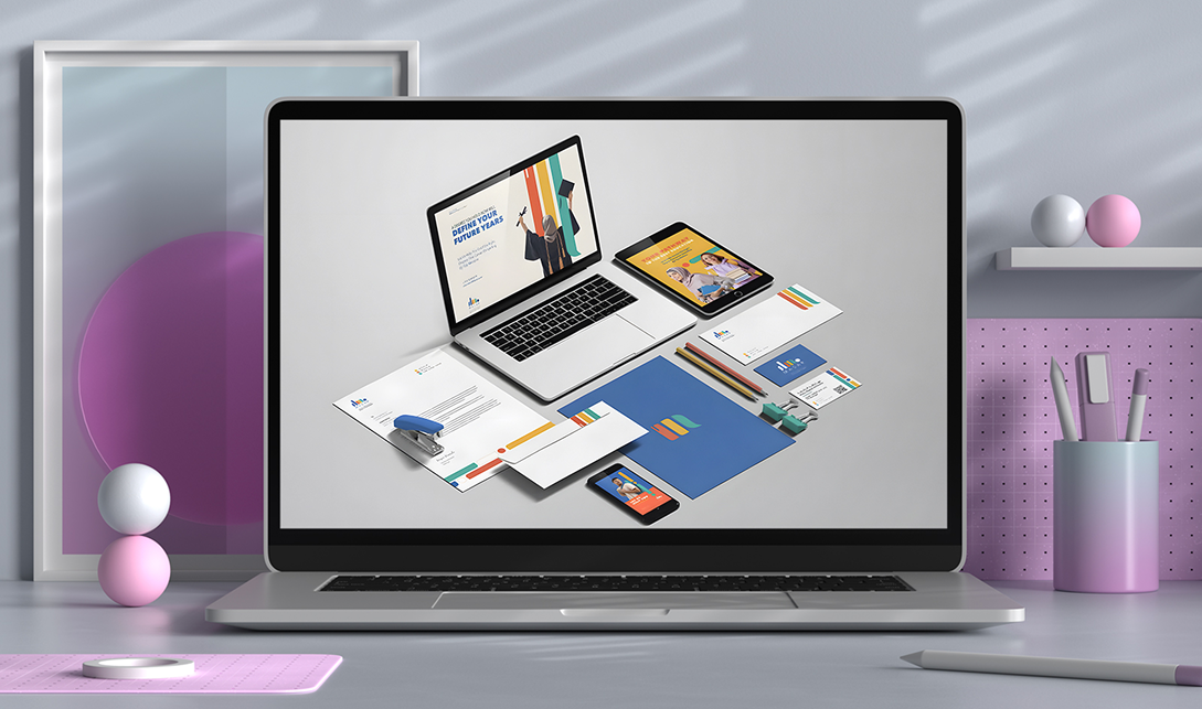 Laptop with branding materials and stationery